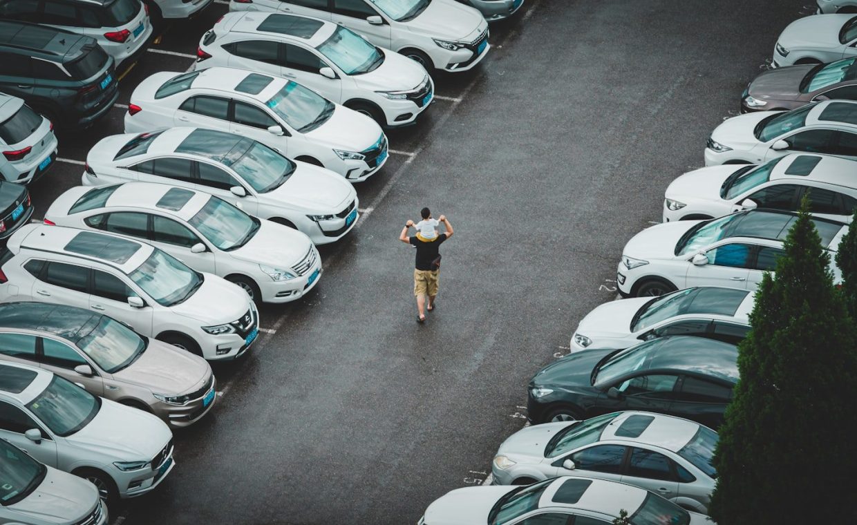 a person standing in a parking lot