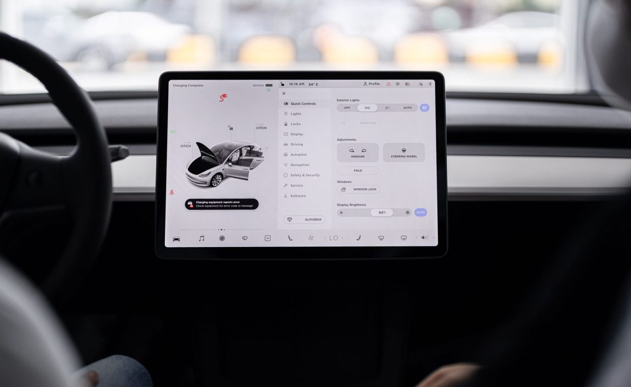 View of a modern car's dashboard featuring a digital display panel with control options.