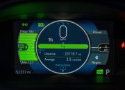 Detailed view of an electric vehicle's dashboard showing speed, battery range, and power metrics.