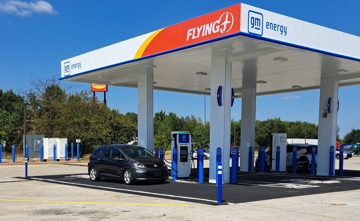A Chevrolet Bolt EV charging at a GM Energy station in Franklin, Kentucky on a sunny day.