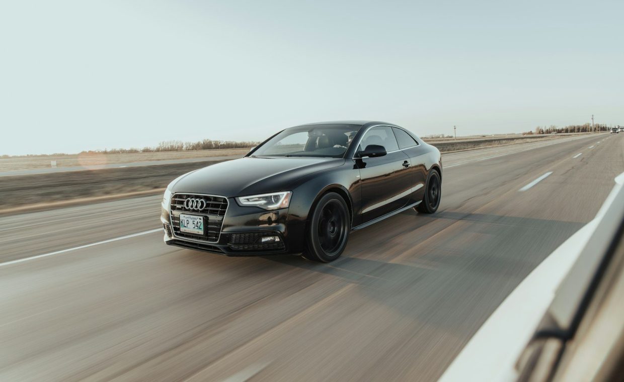 black audi sedan on road during daytime